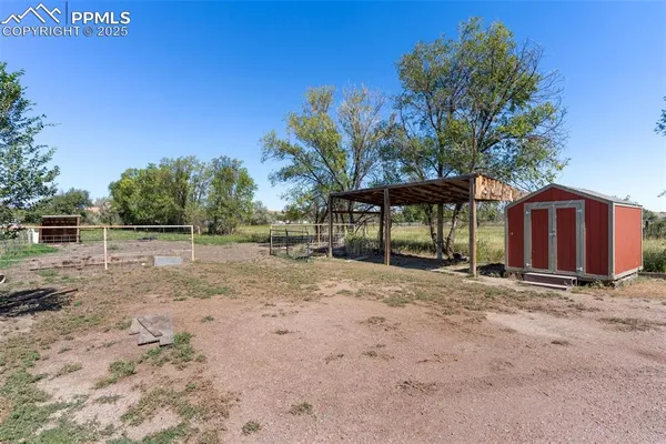 a view of a barn with a yard