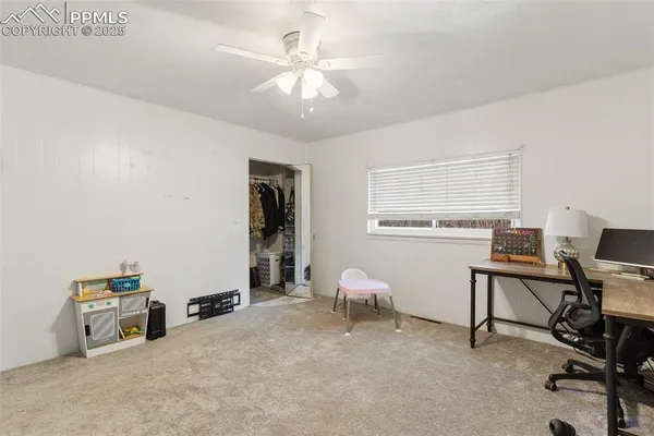 a workspace with furniture and a window