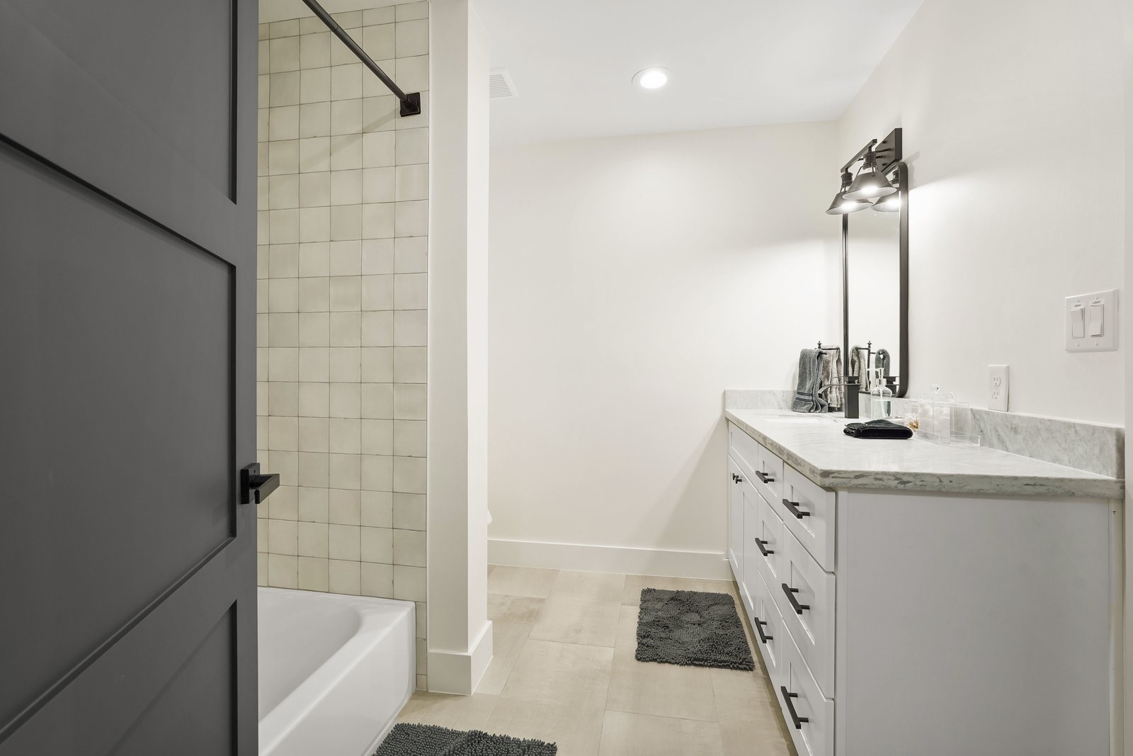 3327 Freshmeadows Drive Houston, TX 77063 - Photo 18 of 35 a bathroom with a granite countertop sink a mirror and shower