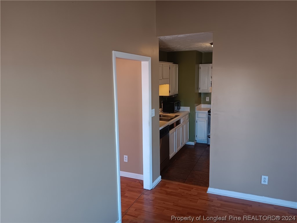 517 Woodwind Drive Spring Lake, NC 28390 - Photo 23 of 32 a view of a kitchen from the hallway