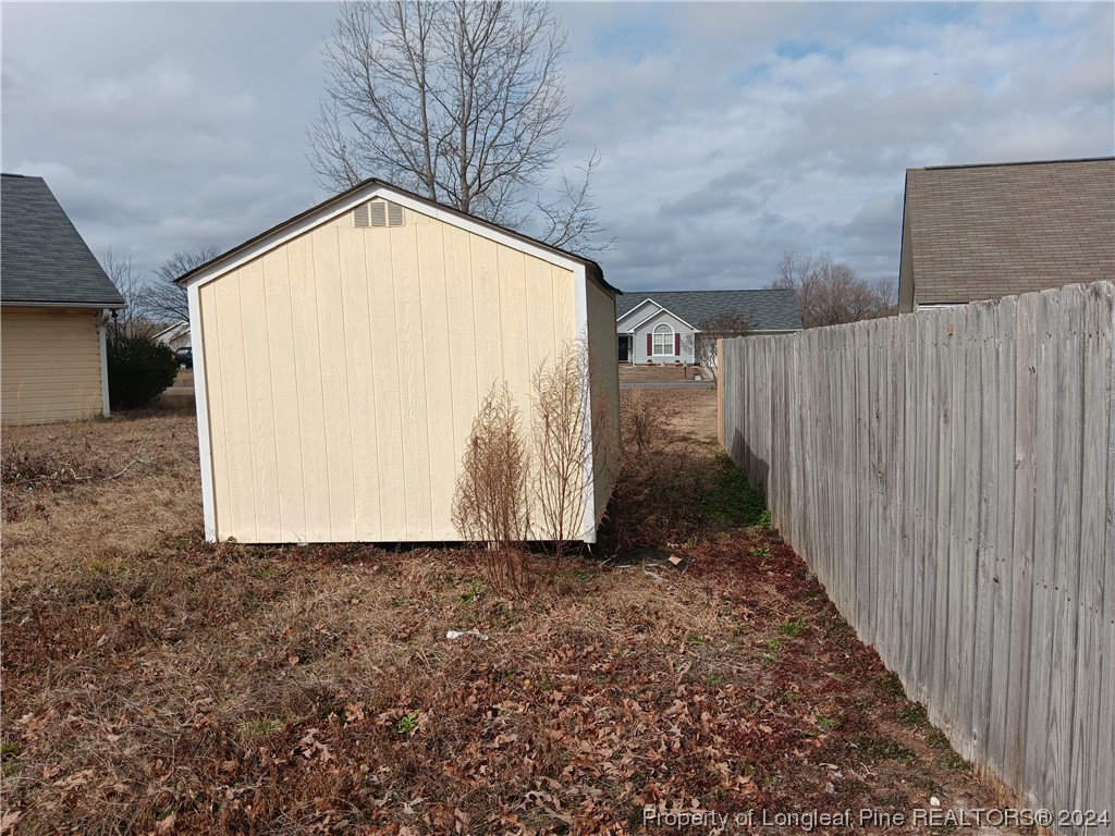 517 Woodwind Drive Spring Lake, NC 28390 - Photo 31 of 32 a view of a wooden door in front of house