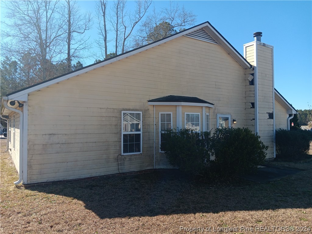 517 Woodwind Drive Spring Lake, NC 28390 - Photo 7 of 32 a front view of house with yard