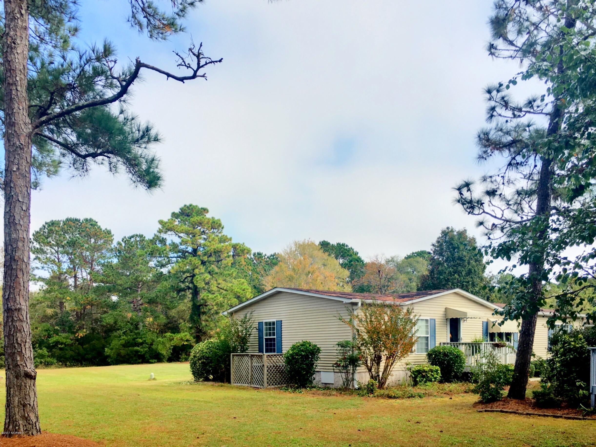 407 Quartermaster Court Hampstead, NC 28443 - Photo 16 of 25 Side of Home