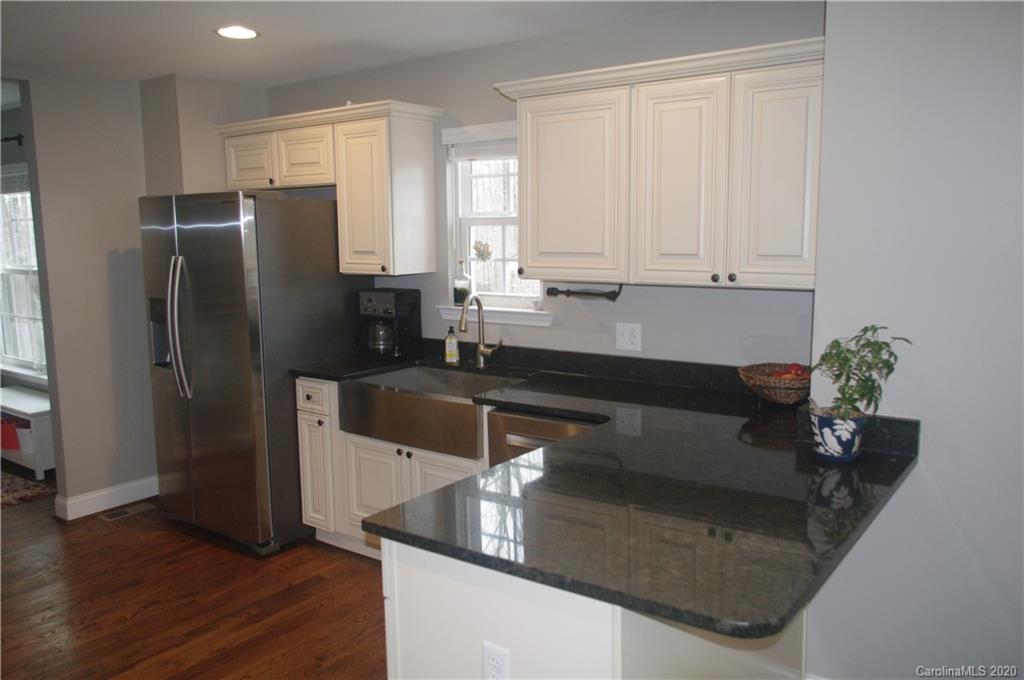 2958 Ranger Road Clover, SC 29710 - Photo 3 of 20 a kitchen with stainless steel appliances granite countertop a refrigerator a sink and white cabinets