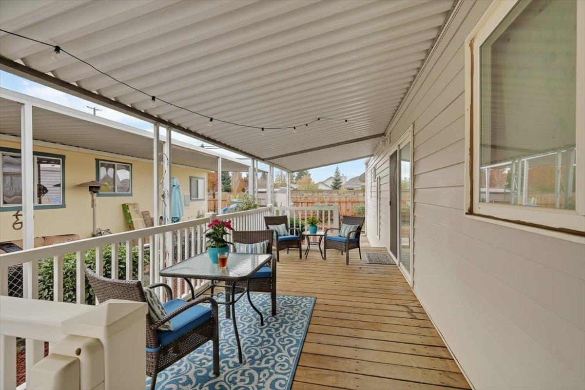 a view of a patio with wooden floor