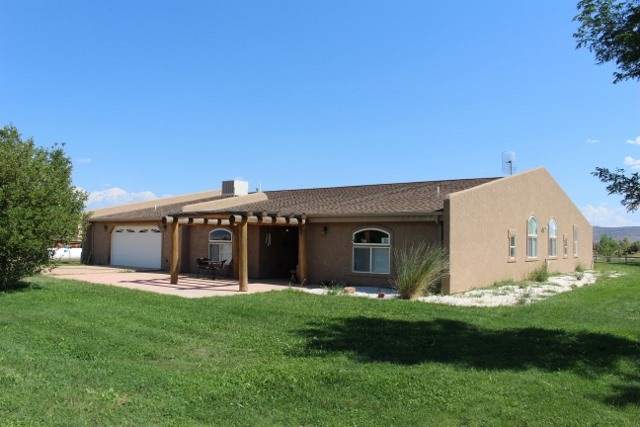 853 R Road Mack, CO 81525 - Photo 1 of 42 a view of a house with a yard and sitting area