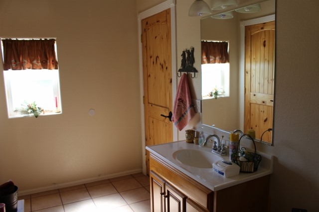 853 R Road Mack, CO 81525 - Photo 21 of 42 a bathroom with a sink and a mirror