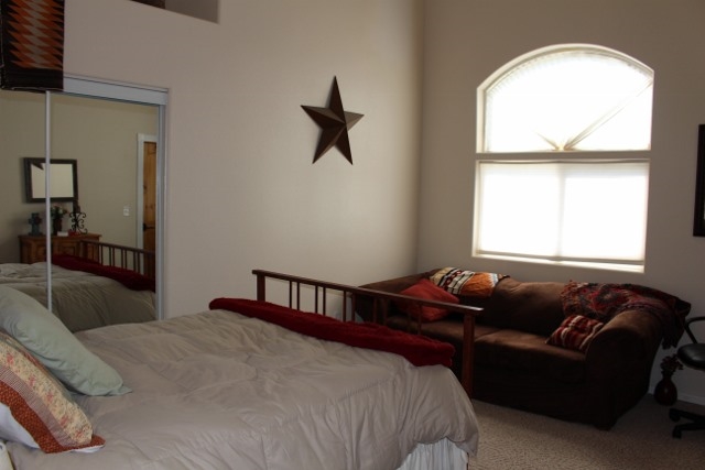 853 R Road Mack, CO 81525 - Photo 23 of 42 a bedroom with a bed couch and window