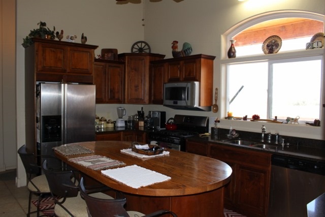 853 R Road Mack, CO 81525 - Photo 30 of 42 a kitchen with stainless steel appliances granite countertop a sink a stove and a dining table