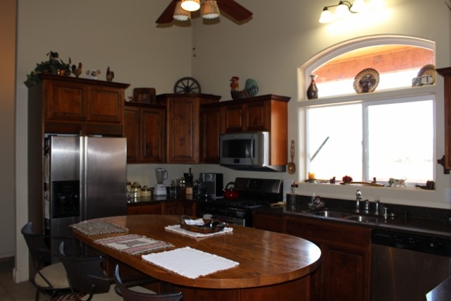 853 R Road Mack, CO 81525 - Photo 32 of 42 a kitchen with a table chairs a stove and a window