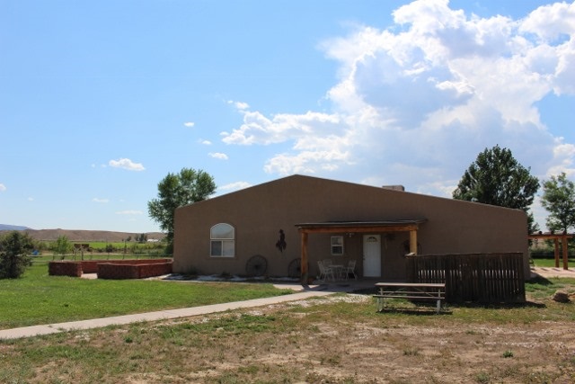 853 R Road Mack, CO 81525 - Photo 7 of 42 a front view of a house with garden
