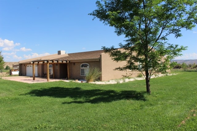 853 R Road Mack, CO 81525 - Photo 9 of 42 a house view with a sitting space and garden