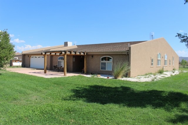 853 R Road Mack, CO 81525 - Photo 10 of 42 a view of a house with a yard and front view of a house