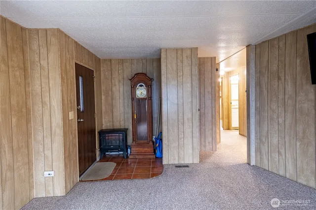a view of empty room with floor to ceiling window