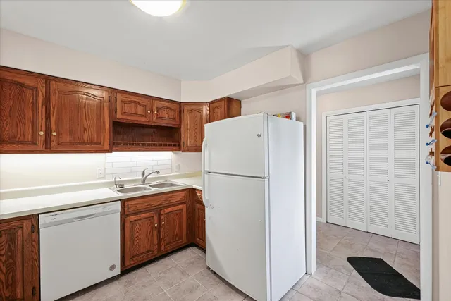 an empty room with fan and windows