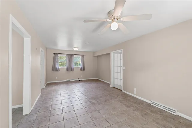 a view of backyard with a deck and wooden floor