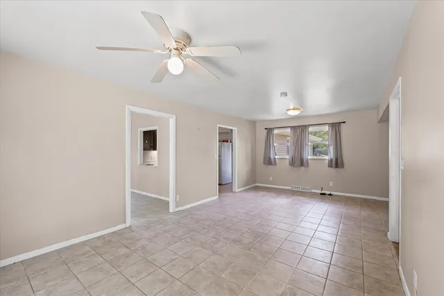 a view of house that has a yard