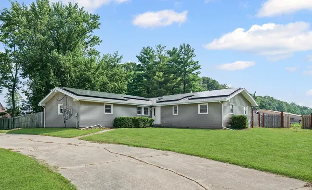 a view of a livingroom with an empty space and a fireplace