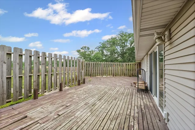a aerial view of a house with a yard table and chairs