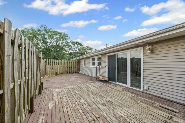 an aerial view of residential houses with yard