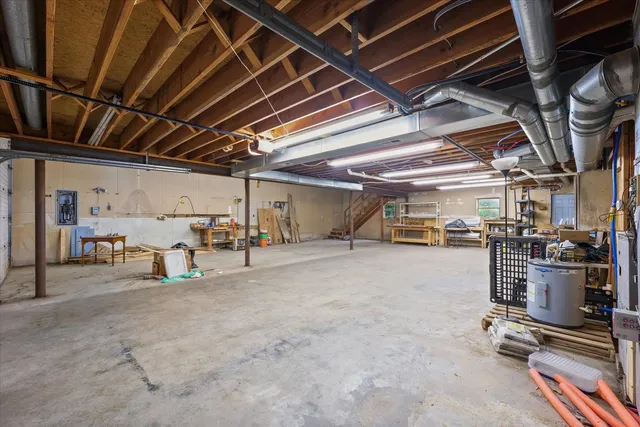 an aerial view of residential houses with outdoor space and trees