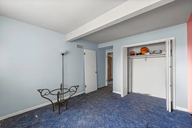 a picture of a bench in front of a building