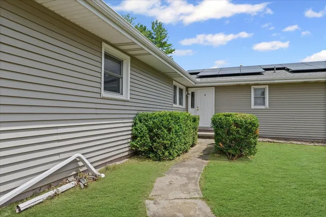 a view of an empty room with glass door and glass door