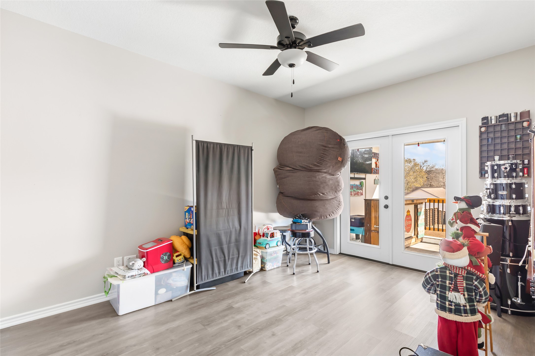 140 Swann Lane Coldspring, TX 77331 - Photo 22 of 30 3rd bedroom used as music/entertainment room has access to back patio and half bath.
