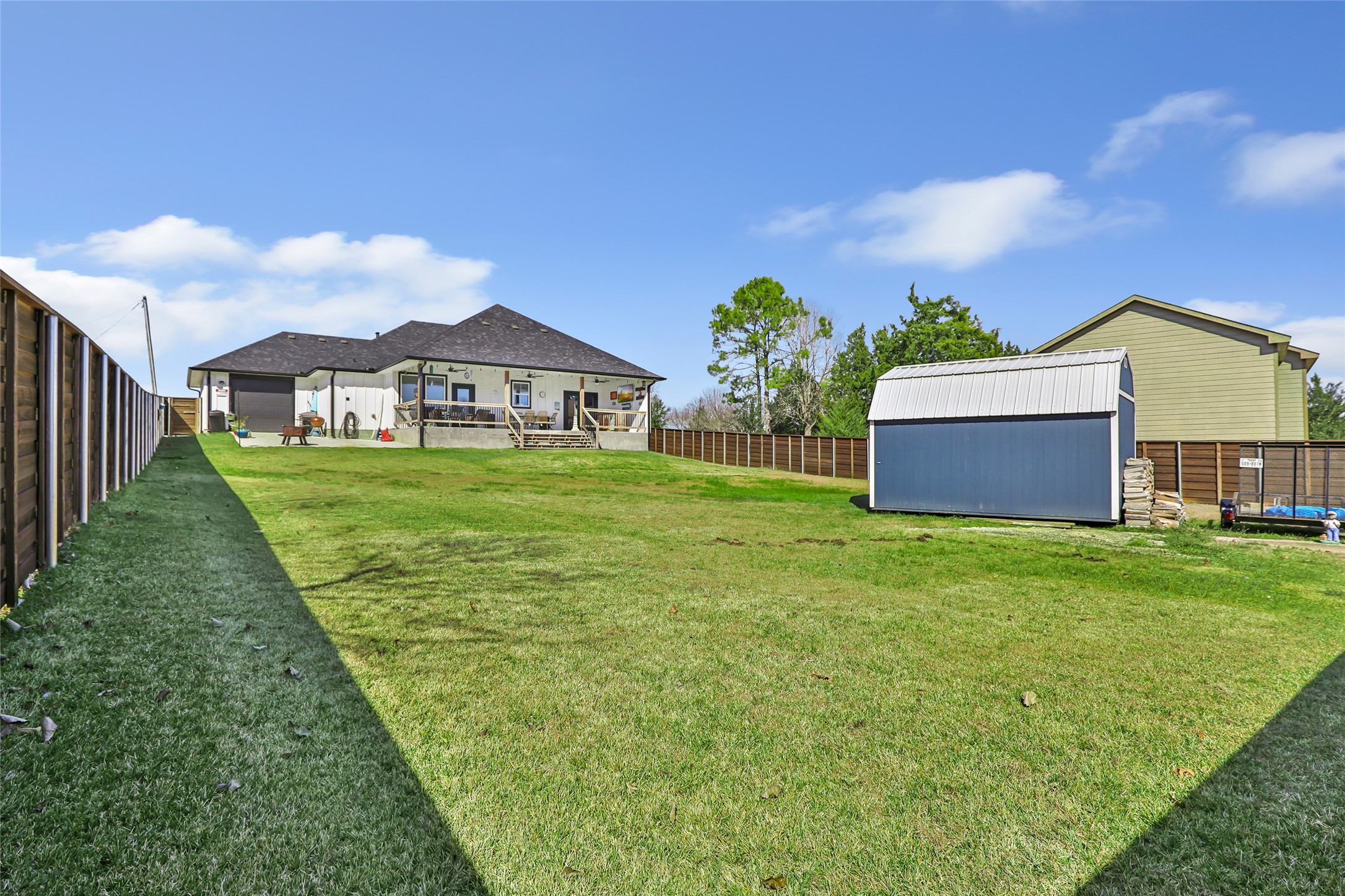 140 Swann Lane Coldspring, TX 77331 - Photo 8 of 30 View of the back of the house from the back of the fence.