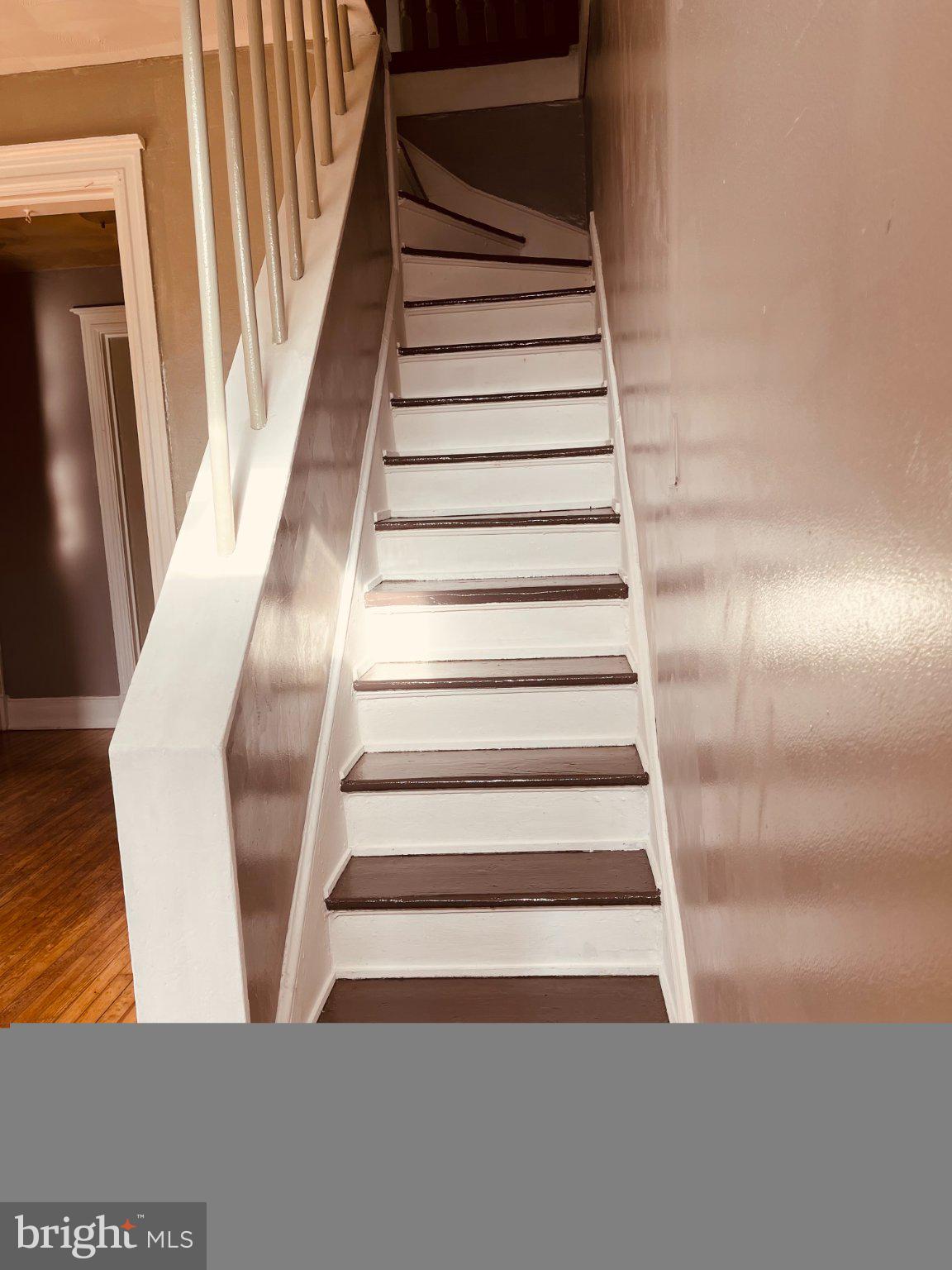 1841 North Capitol Street Northeast Washington, DC 20002 - Photo 3 of 6 Charming staircase to new beginnings.