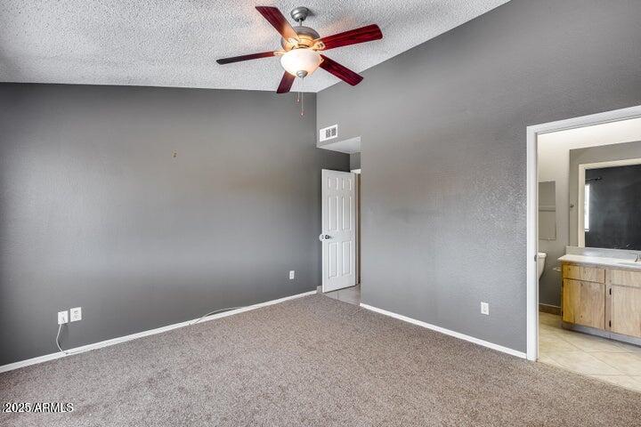 3339 West Mohawk Lane Phoenix, AZ 85027 - Photo 14 of 27 an empty room with closet and fan