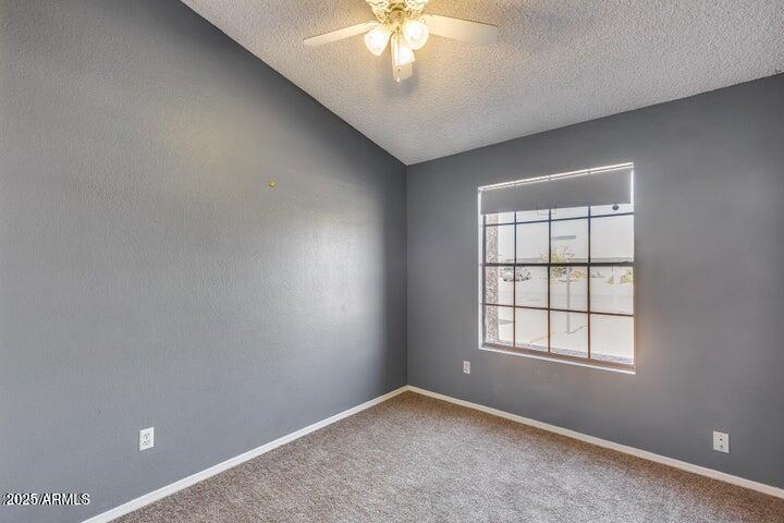 3339 West Mohawk Lane Phoenix, AZ 85027 - Photo 20 of 27 an empty room with a window
