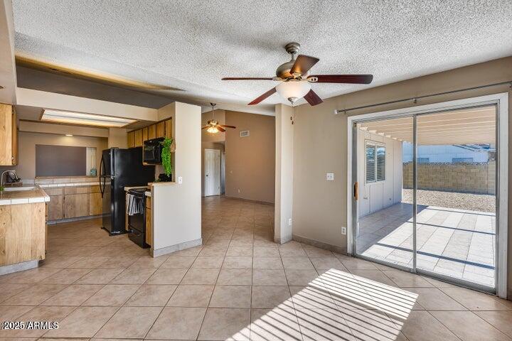 3339 West Mohawk Lane Phoenix, AZ 85027 - Photo 6 of 27 a view of a hallway with a chandelier
