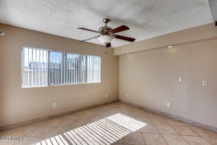 3339 West Mohawk Lane Phoenix, AZ 85027 - Photo 7 of 27 a view of an empty room with a window