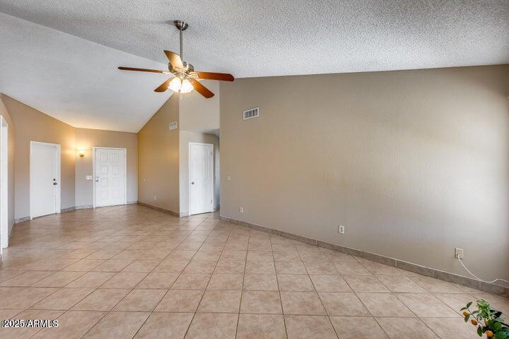 3339 West Mohawk Lane Phoenix, AZ 85027 - Photo 9 of 27 an empty room with windows and fan