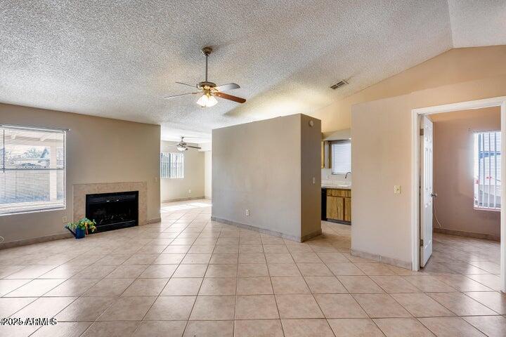 3339 West Mohawk Lane Phoenix, AZ 85027 - Photo 10 of 27 a view of a livingroom with an empty space and a fireplace