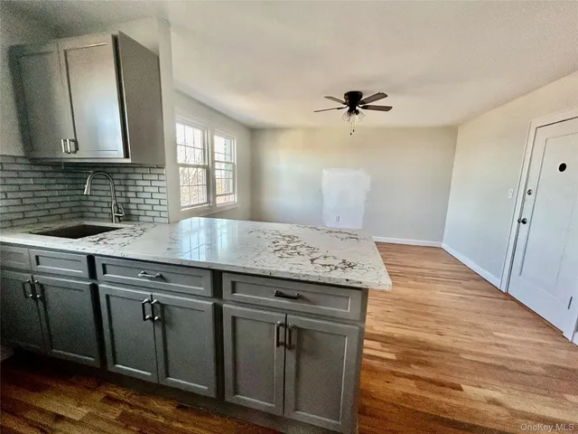 a kitchen with a sink and cabinets