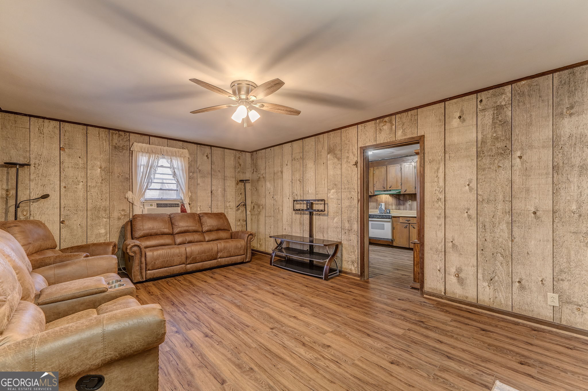 13 Kennemore Road Rome, GA 30165 - Photo 3 of 13 a living room with furniture and a chandelier