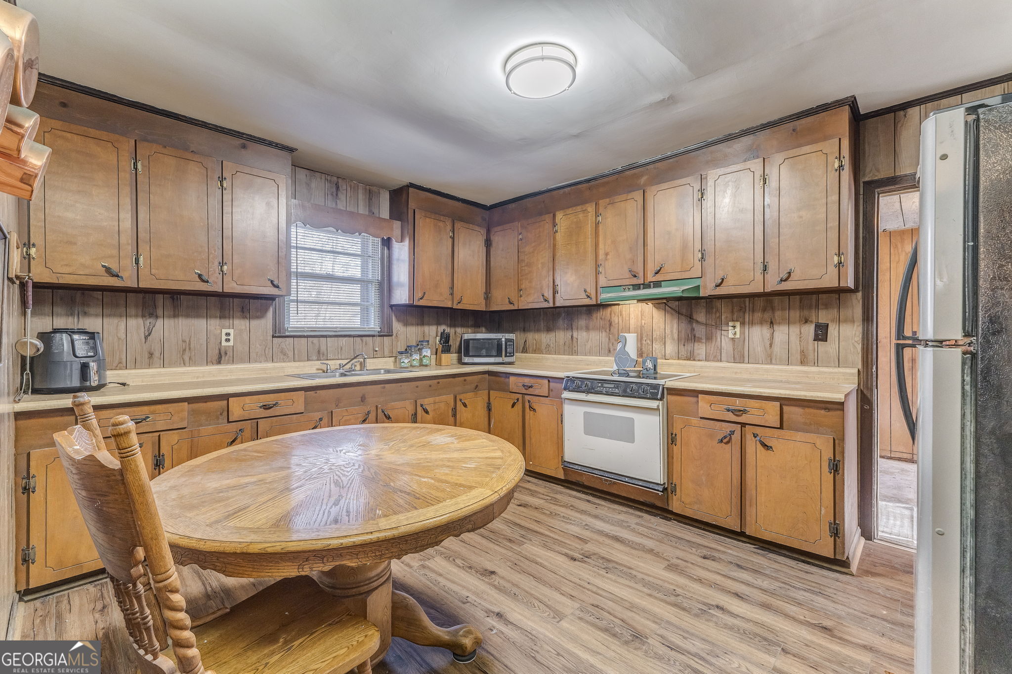 13 Kennemore Road Rome, GA 30165 - Photo 4 of 13 a kitchen with stainless steel appliances granite countertop a stove a sink dishwasher a microwave oven and a refrigerator with wooden cabinets
