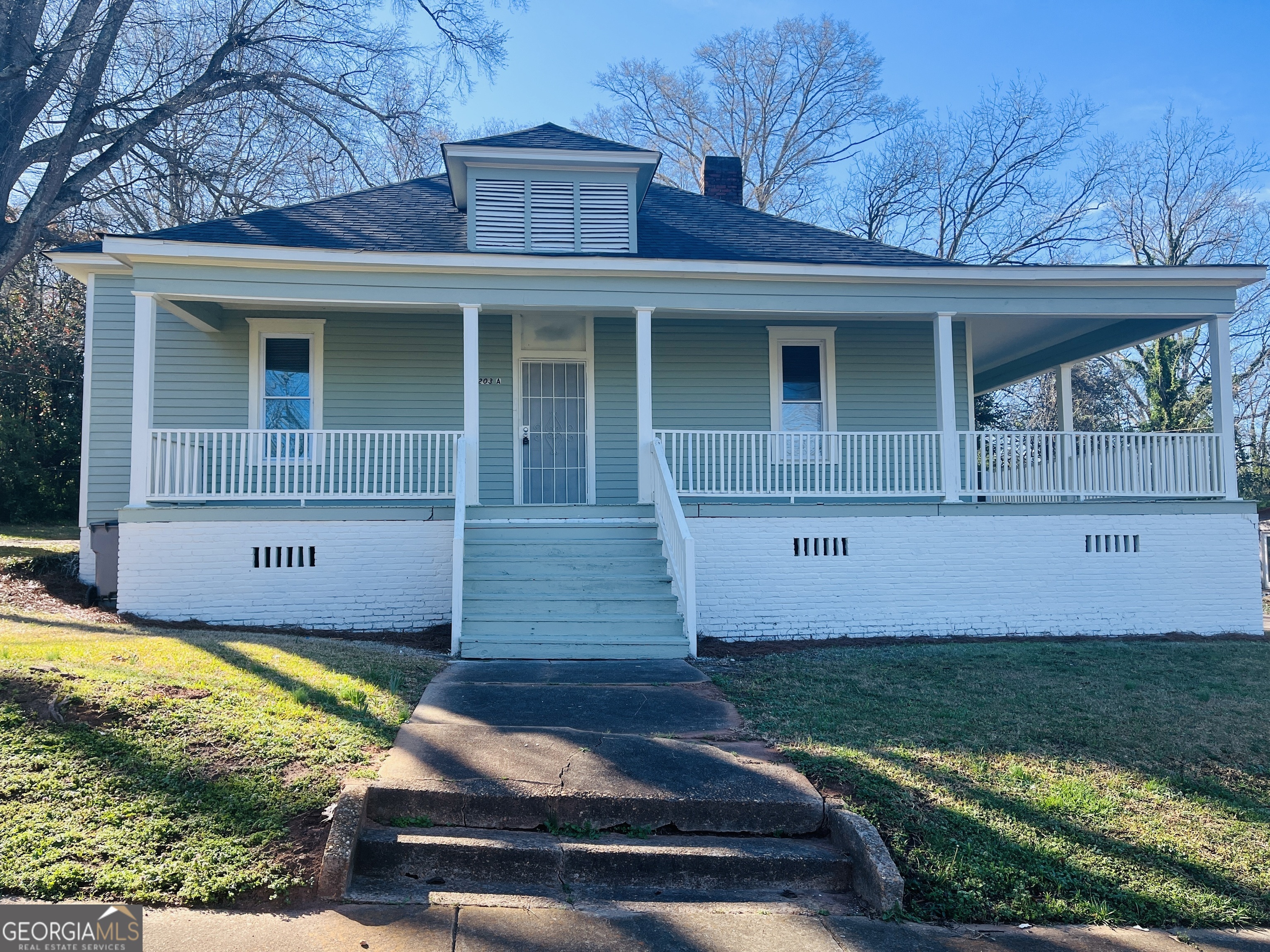 1203 1st Avenue, Unit A LaGrange, GA 30240 - Photo 1 of 17 front view of a house with a yard
