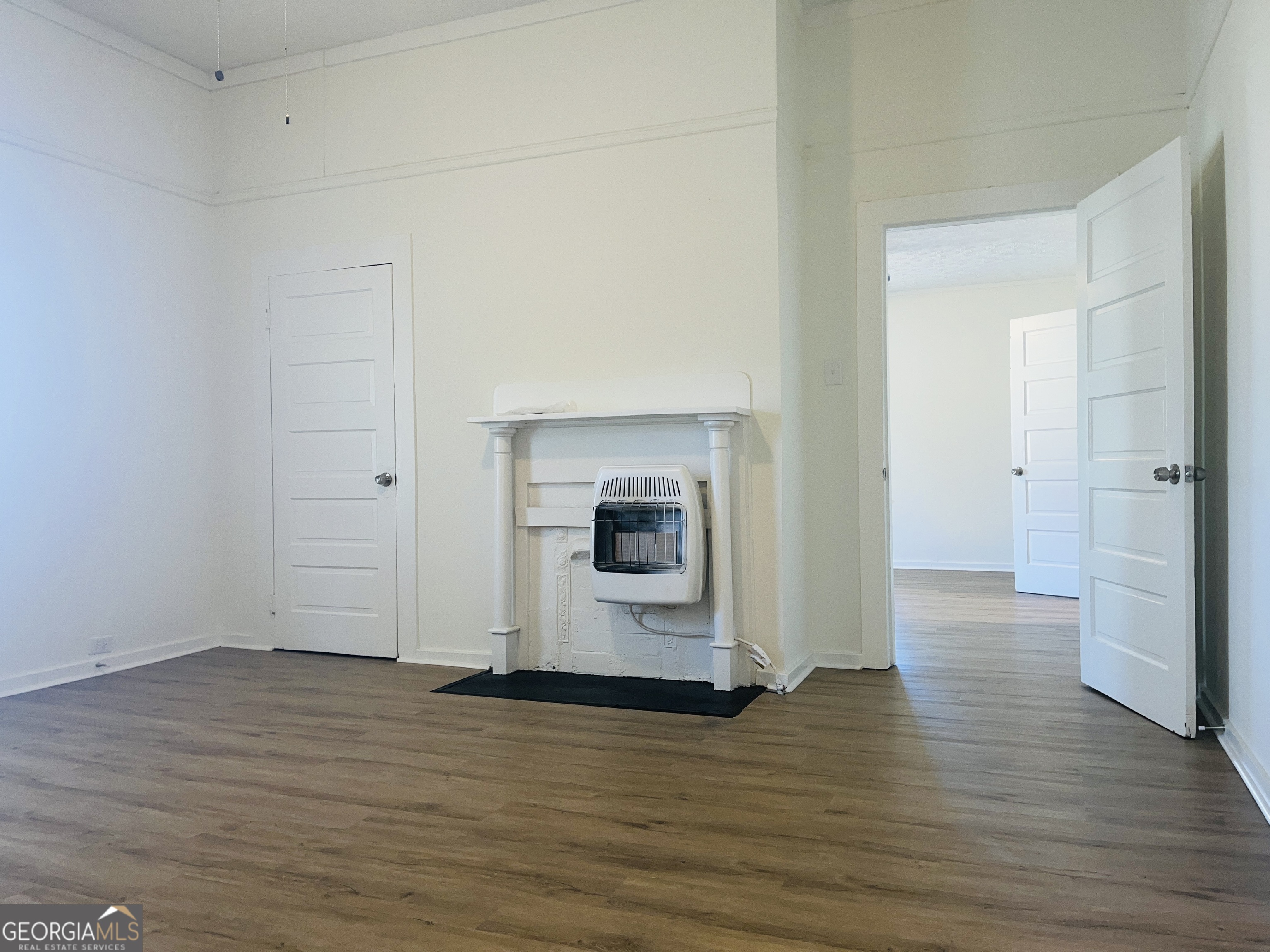 1203 1st Avenue, Unit A LaGrange, GA 30240 - Photo 13 of 17 a view of a room with wooden floor and fireplace
