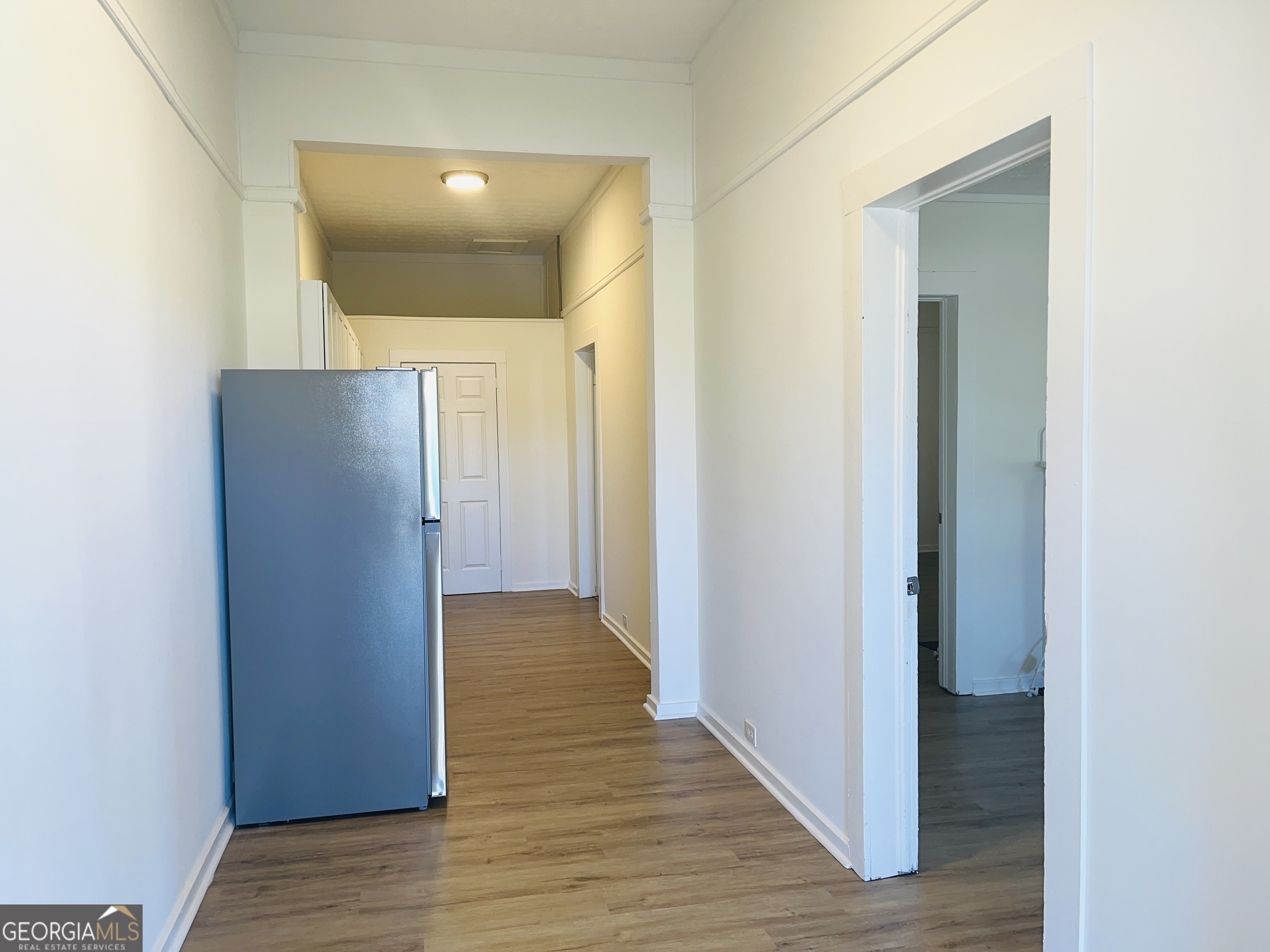 1203 1st Avenue, Unit A LaGrange, GA 30240 - Photo 5 of 17 a view of hallway with wooden floor