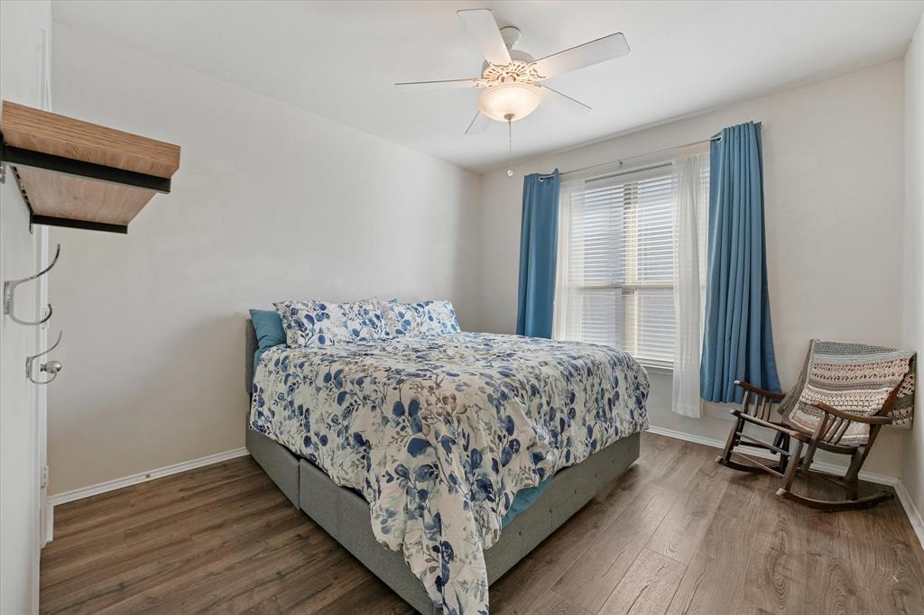 3801 Surf Street Denton, TX 76208 - Photo 16 of 29 Bedroom with dark wood-style floors and a ceiling fan