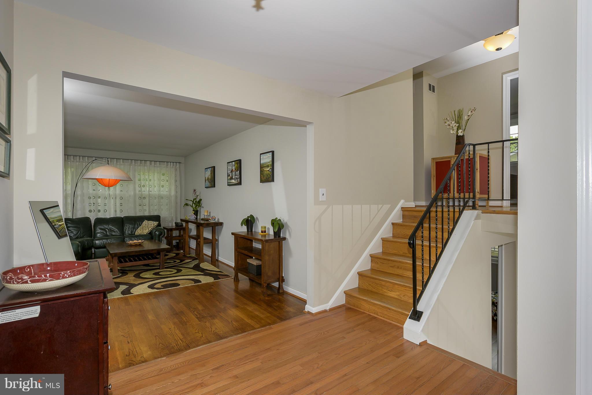 13007 Broadmore Road Silver Spring, MD 20904 - Photo 1 of 30 a living room with furniture and a wooden floor