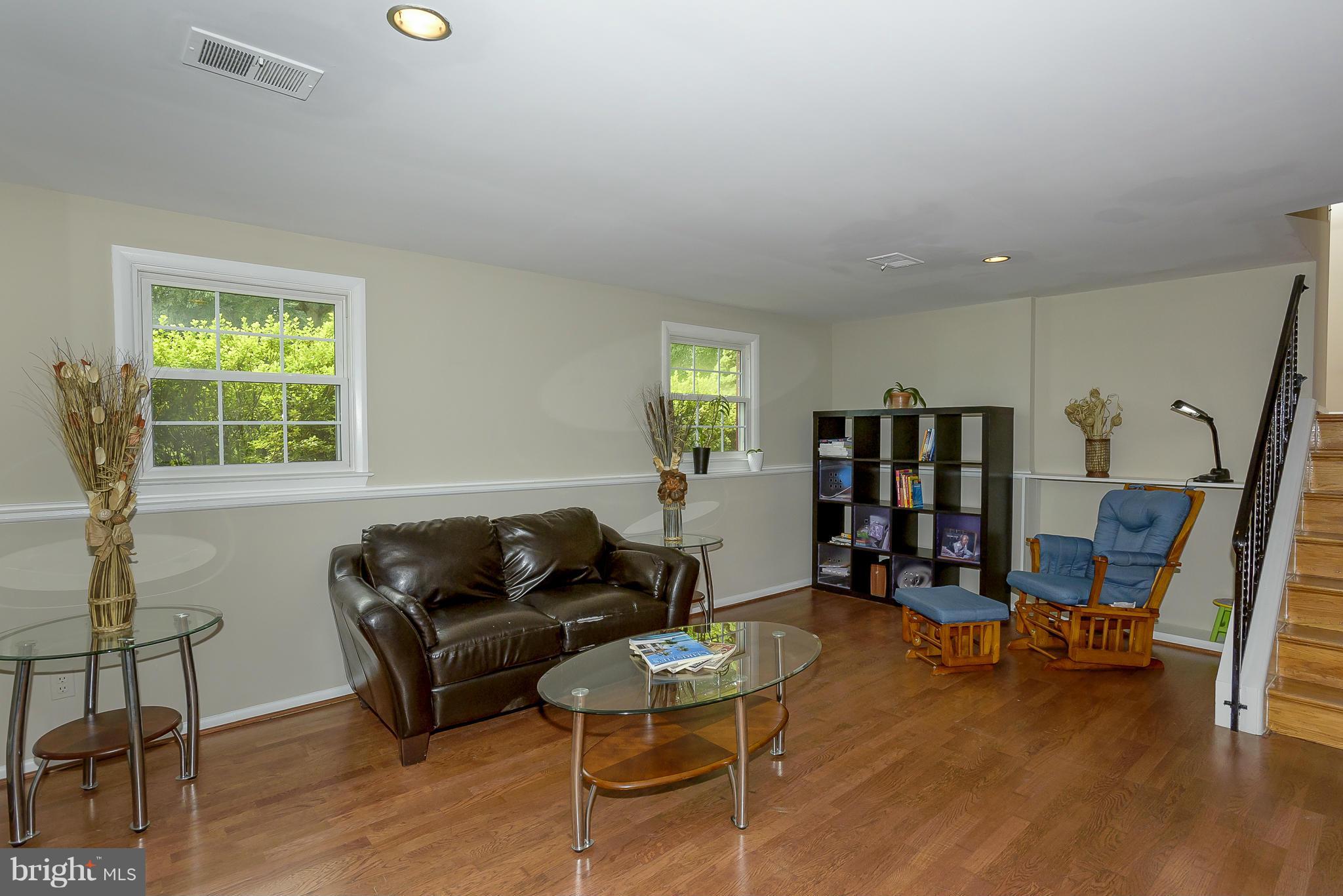 13007 Broadmore Road Silver Spring, MD 20904 - Photo 11 of 30 a living room with furniture and a wooden floor