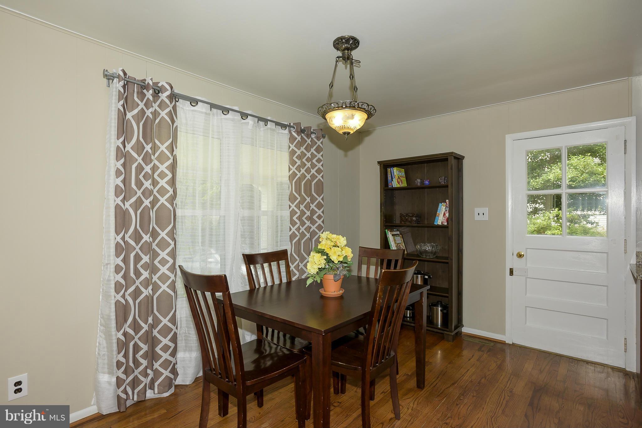 13007 Broadmore Road Silver Spring, MD 20904 - Photo 12 of 30 a view of a dining room with furniture window and wooden floor