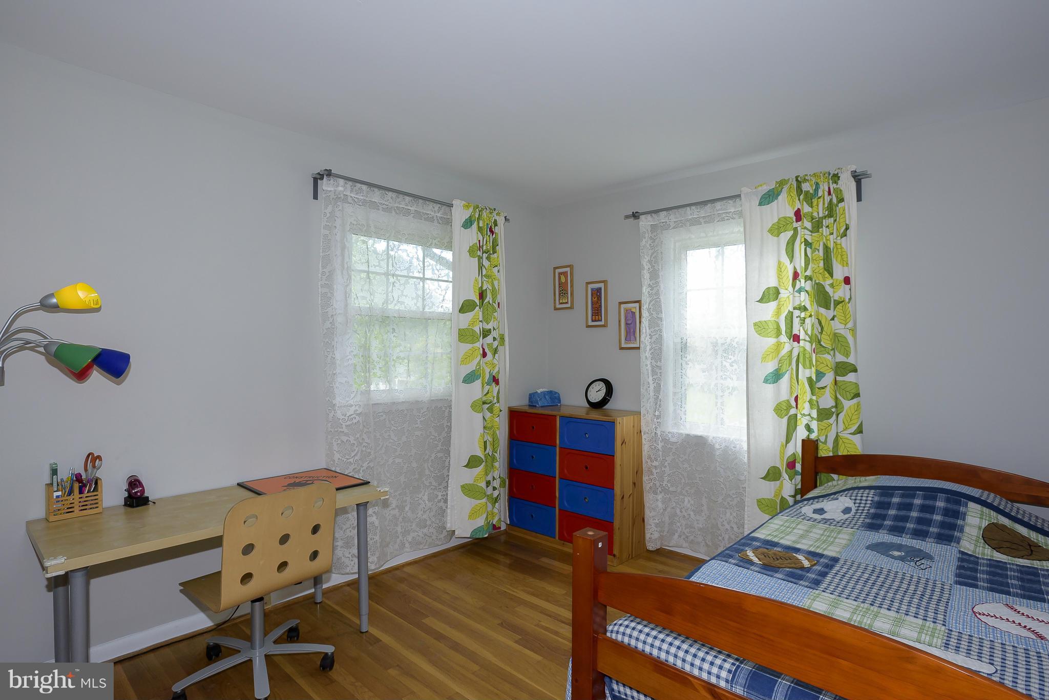13007 Broadmore Road Silver Spring, MD 20904 - Photo 19 of 30 a bedroom with a bed and a window