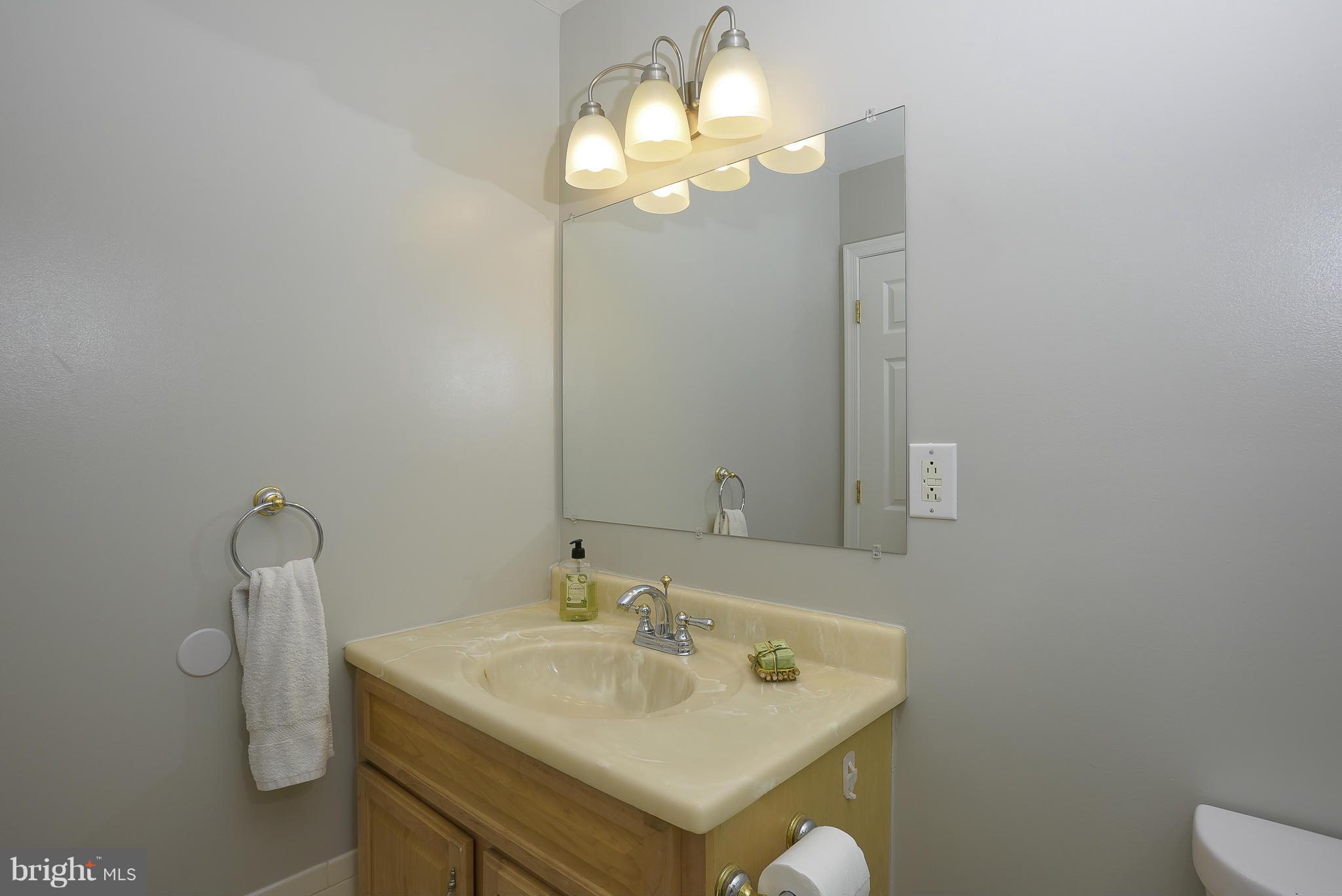 13007 Broadmore Road Silver Spring, MD 20904 - Photo 21 of 30 a bathroom with a sink and a mirror