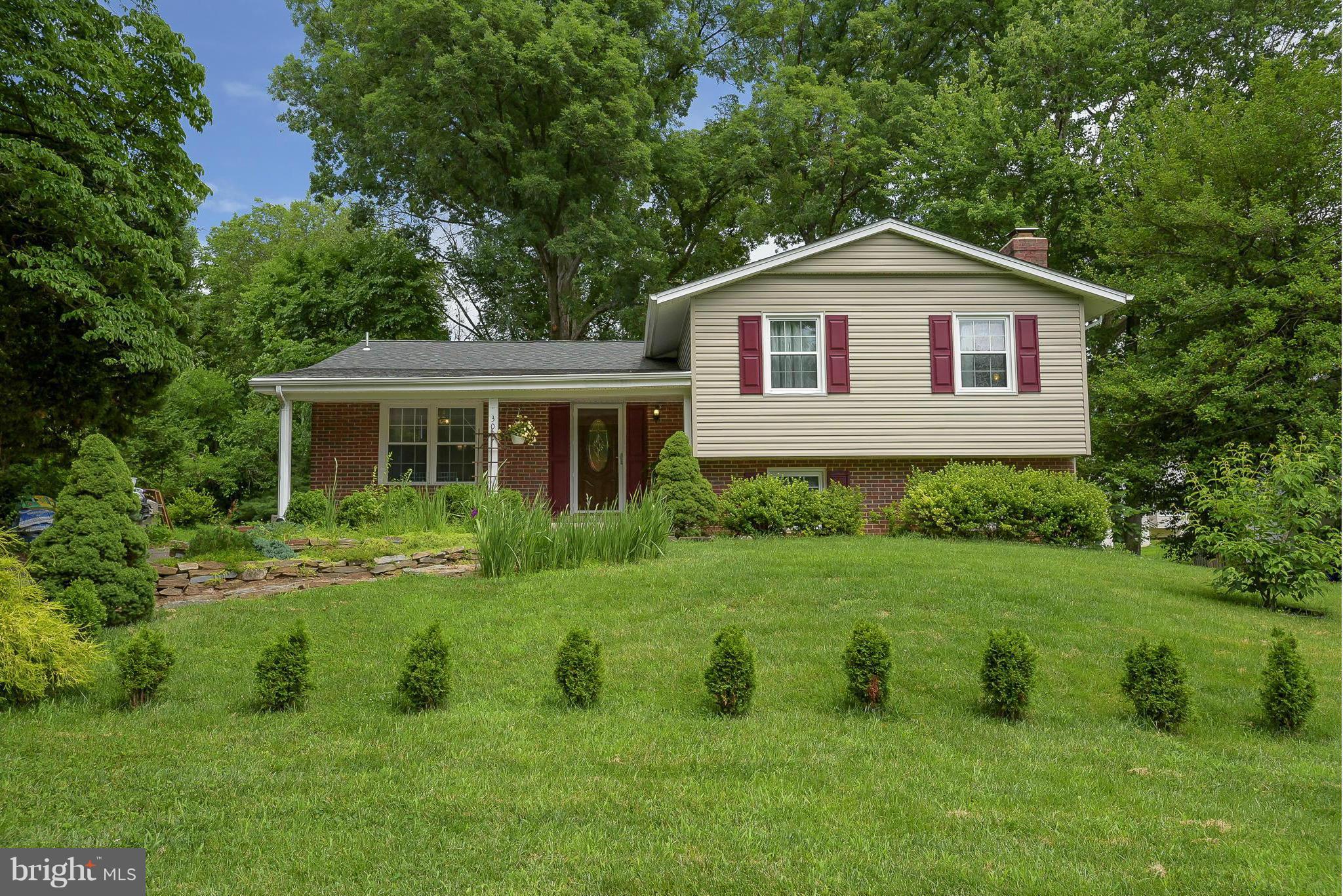 13007 Broadmore Road Silver Spring, MD 20904 - Photo 27 of 30 a front view of a house with a yard
