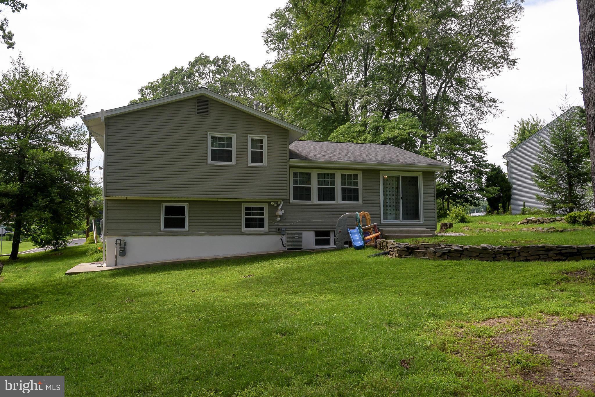 13007 Broadmore Road Silver Spring, MD 20904 - Photo 28 of 30 a view of a house with a yard and sitting area